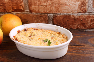 crumble with apples in white dish