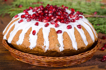 Celebratory cake decorated with pomegranate and sugar icing