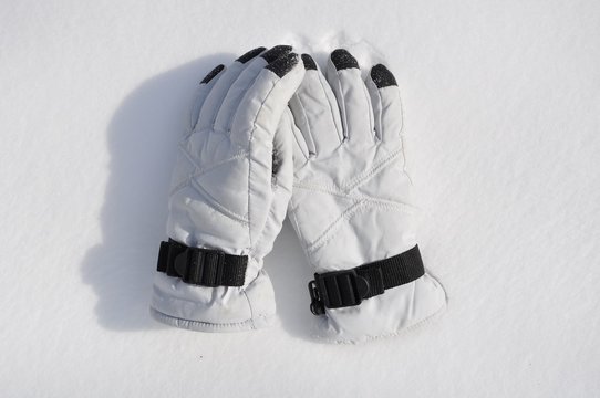 White gloves over snowy grounds