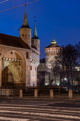 Fototapeta na wymiar Medieval barbicane and Florianska gate tower in the morning, Krakow, Poland