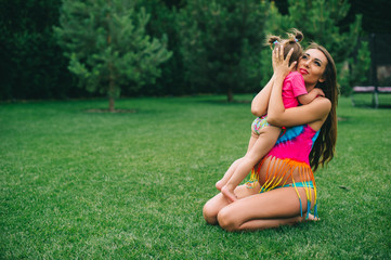 Fototapeta premium pregnant woman with her daughter