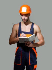 Handsome man keeps accounting book