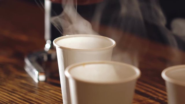 Close up of three cups of delicious coffee on the wooden table