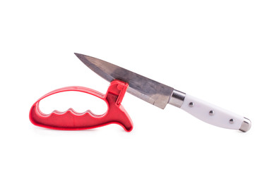 Grindstone and knife isolated on the white background
