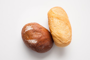 Loafs of bread – brown and white.