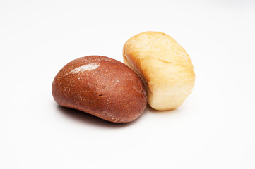 Loafs of bread – brown and white.