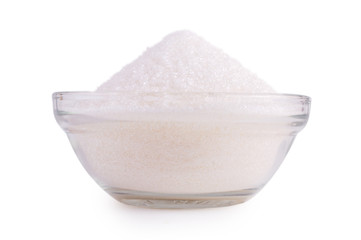 Sugar in glass bowl isolated on white