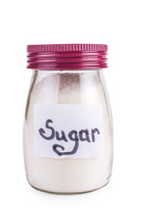 glass jar with sugar. Isolated on white.
