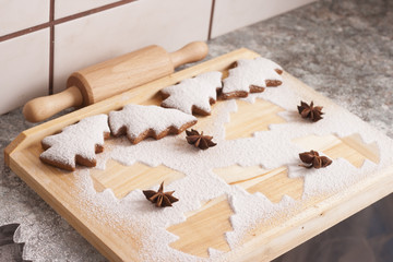 christmas gingerbread cookies baking process , dough and rolling pin,shallow depth of field.