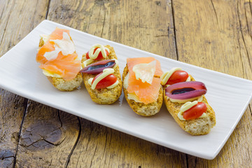 Tasty appetizer of canapes and vegetables