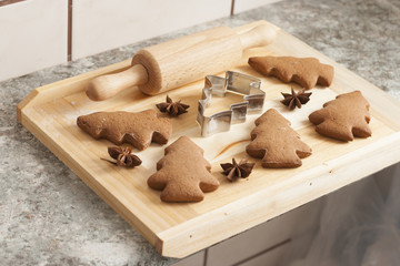 christmas gingerbread cookies baking process , dough and rolling pin,shallow depth of field.