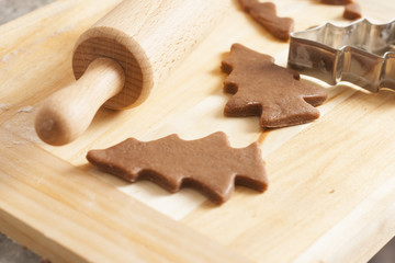 christmas gingerbread cookies baking process , dough and rolling pin,shallow depth of field.