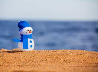 Snowman on sand