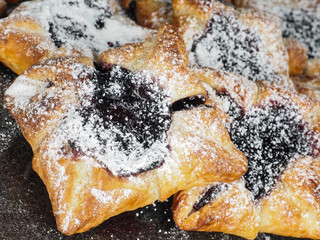Danish pastry with blueberry jam filling with white powdered sug