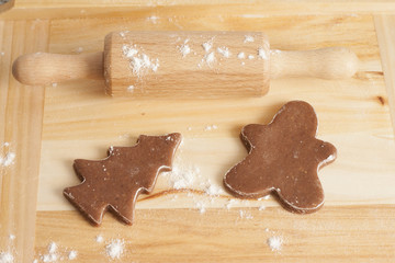 christmas gingerbread cookies baking process , dough and rolling pin,shallow depth of field.
