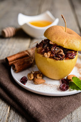 Baked apple stuffed with nuts, dried fruit and honey