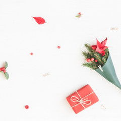 Christmas composition. Gift, bouquet made of traditional christmas plants. Flat lay, top view