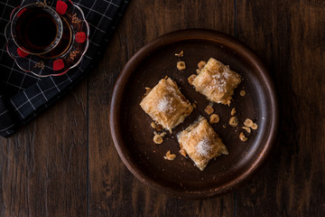 Turkish Dessert Baklava with tea / Sutlu Nuriye.