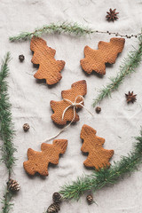 Christmas composition. Larch branches, anise star, christmas cookies. Flat lay, top view