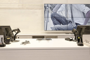 counters and displays in front of a wall with empty space