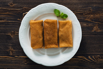 Pancakes with condensed milk on a plate