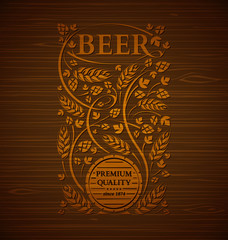 Vector beer emblem with hops and malt on a wooden background