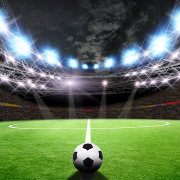 Soccer field with green grass and lights