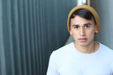 Serious hip Latino teen outdoors close up © ajr_images