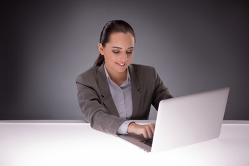 Young businesswoman working with laptop in business concept