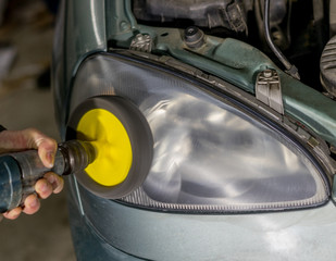 car lamp or front headlight polishing, renewed headlamp. © yelantsevv