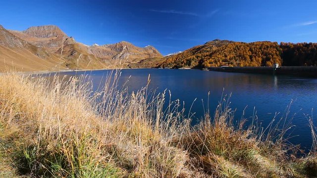 View of lake Ritom in Piora near Gotthard, Canton Ticino of Switzerland with Swiss Alps in the background, Switzerland, Europe. 
