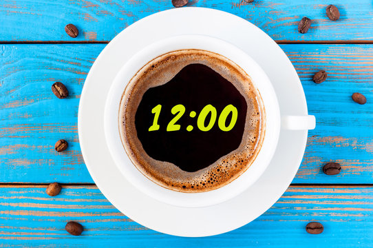 It's twelve o'clock already. Time to wake up and hurry. An image of a top viewed coffee cup with clocks face showing 12:00 am or pm