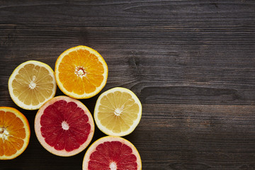Naklejka na ściany i meble sliced citrus fruit on the verge