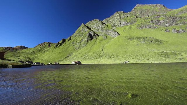 View of lake Ritom in Piora near Gotthard, Canton Ticino of Switzerland with Swiss Alps in the background, Switzerland, Europe. 
