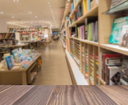 Wooden board empty table in front blurred photo of book store