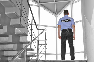 Security man standing on stairs