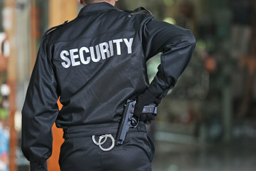 Security man standing indoors