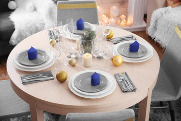 Table served for Christmas dinner in living room