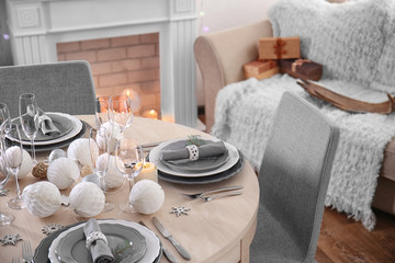 Table served for Christmas dinner in living room