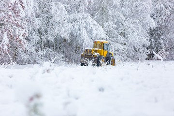 Winter landscape with machine (snow plow at work)