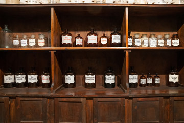 Vintage bottles with ingredients in the old pharmacy