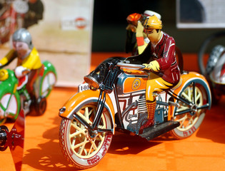 Tin toys - An old tin motorcycle rider  in an antiques fair in Italy.