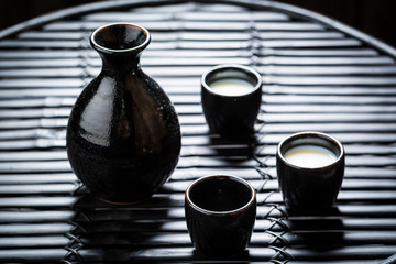 Delicious sake in Asian restaurant on black table