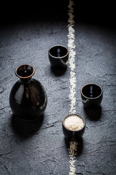Enjoy your sake in black ceramics on black rock