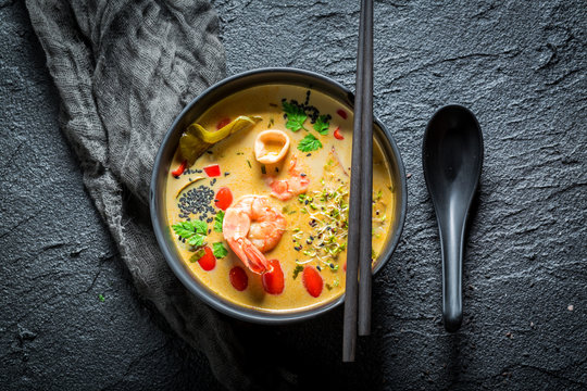 Hot Tom Yum soup with shrimps and coconut milk