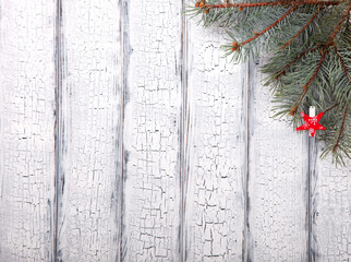 Christmas White Wooden  Background with crackling effect and  Fir Branch.Winter Holidays Concept. top view. Copy space. selective focus.
