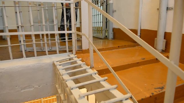 Prisoner lead the prison corridor. Inside the prison. Russian correctional system