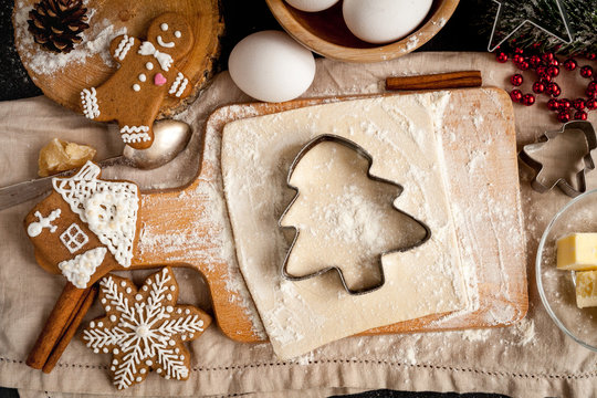 cooking christmas gingerbread on wooden background top view