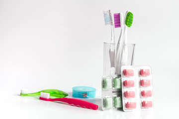 toothbrushes in glass on white background tools for oral care