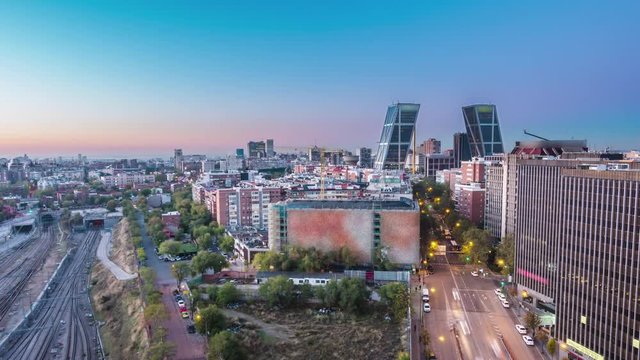 madrid skyline aerial view timelapse from night to day sun lighting the city
